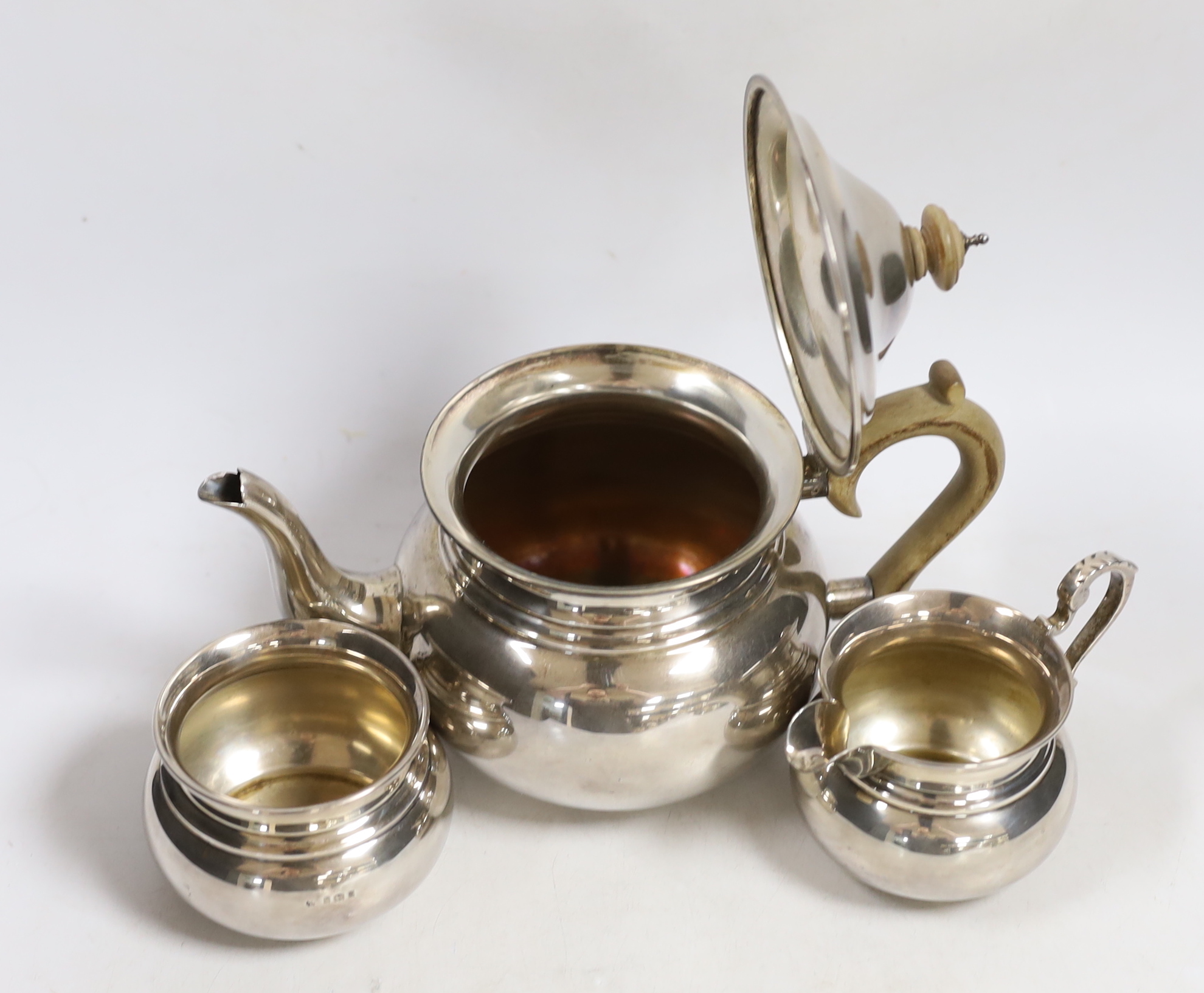 A George V silver three piece tea set, Blackmore & Fletcher Ltd, London, 1925